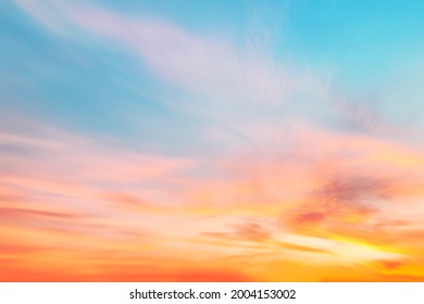 Blur pastels gradient sunset background on soft nature sunrise peaceful morning beach outdoor. heavenly mind view at a resort deck touching sunshine, sky summer clouds.