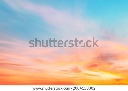 Blur pastels gradient sunset background on soft nature sunrise peaceful morning beach outdoor. heavenly mind view at a resort deck touching sunshine, sky summer clouds.