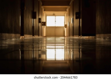 Blur Pathway In Dormitory Or Condominium And Reflection With The Soft Light. Blur Long Dark Hallway