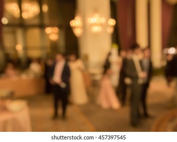 Blur People In  Dining  Room At  Night