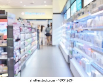 Blur Pharmacy Shop Or Retail Drug Store Interior Background With Pharmaceutical, Cosmetic And Medicine Supplies On Shelves 