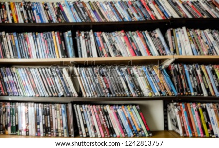 Blur photo, collection of movies, shelf full of DVD.