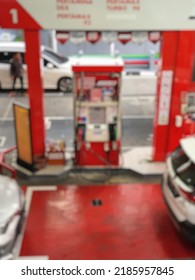 Blur Photo Of Government Owned Red Gas Station Operating In Jakarta