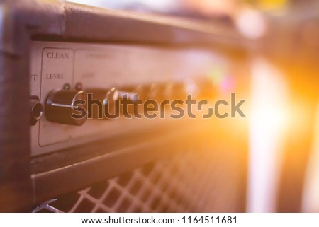 blur photo,A close-up of the power amplifier inside the rehearsal room makes it possible to see the amplifier's power amplifier in a beautiful and classic shape on the background of the sunrise.