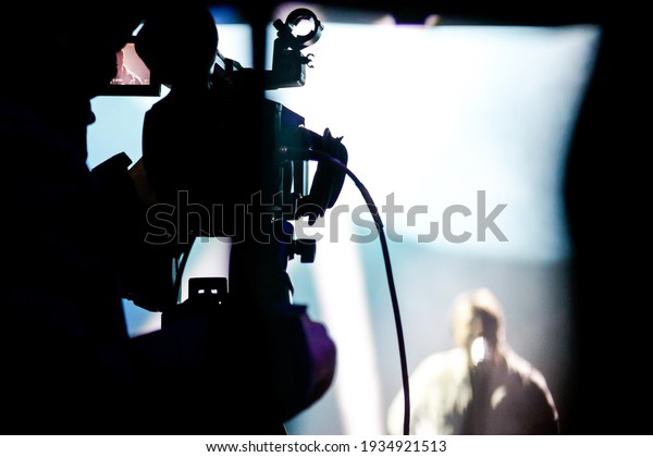 Blur - Photographer video recording activity within\
the event show
