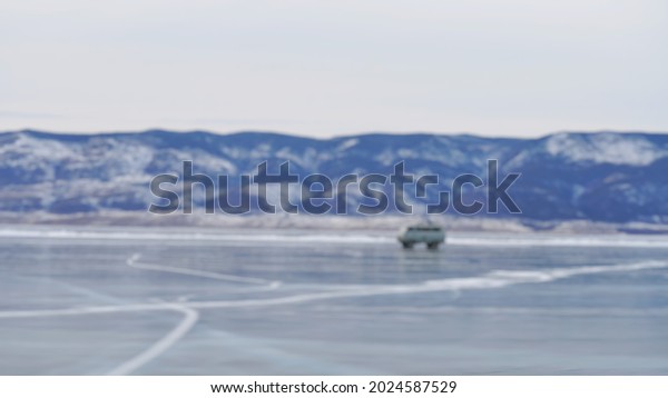 Blur picture background of snow mountain with\
frozen lake at Russia,  Europe.\
