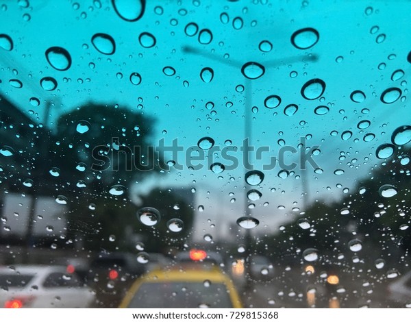 Blur rain on car\
glass.