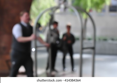 Blur Scene Bellman With Luggage Cart.