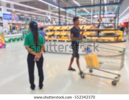 Blur security officer women in a department store.