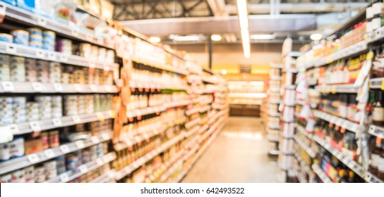 Blur Selection Of Salad Dressing, Pickles, Condiments, And Canned Beans/veggies/soups On Shelves In Store At Houston, Texas, US. Defocused Background Of Aisles, Row And Variety Product. Panorama Style