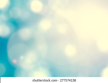 Blur Sky Background With Nature Glowing Sun Light Flare And Bokeh In Cyan Green Blue Color 