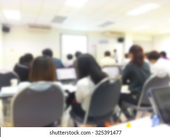 Blur Student During Study Or Lecture And Quiz With Teacher Or Professor In Classroom With Notebook In Master Degree Of Industrial Management Engineering Programs Or MBA At Thailand University 