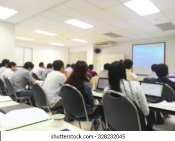 Blur Student During Study Or Lecture And Quiz Or Exams From Teacher Or Professor In Classroom With Notebook In Master Degree Of Industrial Management Programs Or MBA Class. Study Concept. 