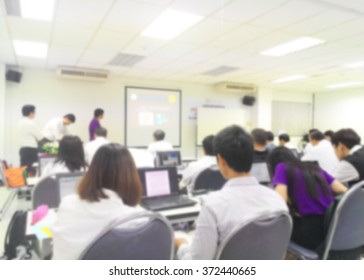 Blur Student During Study Or Lecture And Exams From Professor In Classroom With Notebook With Screen Projector In Master Degree Of Engineering Course Or MBA Class Or Business Seminar, Business Meeting