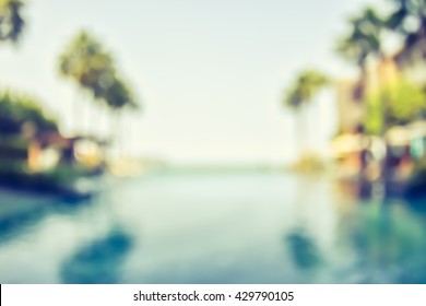 Blur Summer Background For Resort Hotel Pool Party With Blue Cool Sky And Tropical Palm Tree