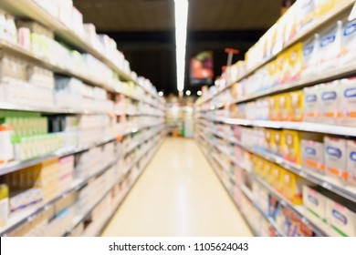 Blur Supermarket Aisle With Baby Formula Milk Product On The Shelf