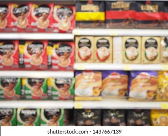 Blur Supermarket Sale Goods On The Shelf Of A Grocery Store. Coffee, Coffee Drinks And Tea On Shelves Background.