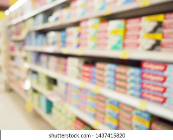 Blur Supermarket Sale Toothpaste Or Gel Dentifrice On Shelves Background, Many Toothpaste Sale On The Shelf In A Supermarket, As Blurred Effect Background, Toothpaste Section.