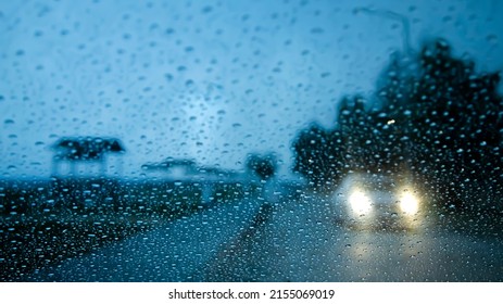 Blur Texture Background For Design ,car Headlight And Raindrops In The Background Out Of Focus.