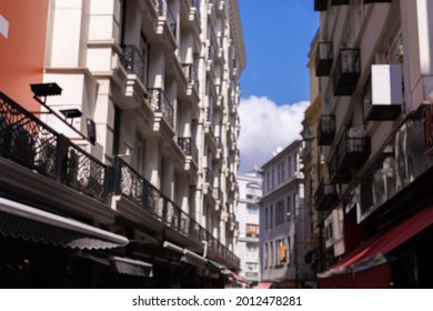 Blur texture background for design. Out of focus views of the streets of an eastern city on a sunny summer day