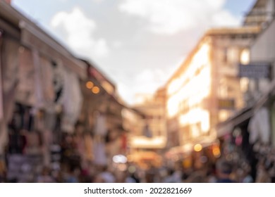 Blur texture background for design. Out of focus views of streets with buildings and roads with cars in the city on a sunny summer day
