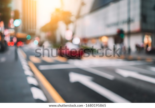 Blur\
traffic road with colorful bokeh light and old building town\
abstract background. Copy space of transportation and travel\
concept. Retro tone filter effect color\
style.