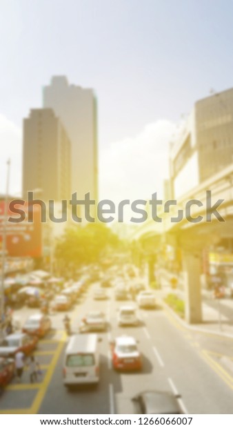 Blur\
traffic road with sun flare abstract\
background.