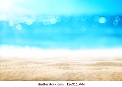 Blur tropical beach with bokeh sun light wave abstract background. Copy space of outdoor summer vacation and travel adventure concept. Vintage tone filter effect color style.