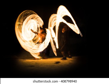Blur two human show with fire with long speed shutter