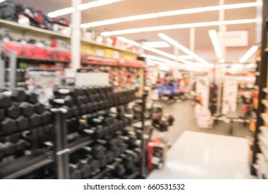 Blur Variety Of Fitness Equipment On Display At Sporting Goods Store In Houston, Texas, US. Defocused Pile Of Dumbbells, Weight, Strength Training, Stepper, Cardio Machines, Gym Room Facility Service