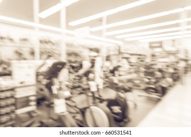 Blur Variety Of Fitness Equipment On Display At Sporting Goods Store In Houston, Texas, US. Defocused Pile Of Dumbbells, Weight, Strength Training, Stepper, Cardio Machines, Gym Service. Vintage Tone.