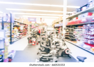 Blur Variety Of Fitness Equipment On Display At Sporting Goods Store In Houston, Texas, US. Defocused Pile Of Dumbbells, Weight, Strength Training, Stepper, Cardio Machines, Gym Service. Vintage Tone.