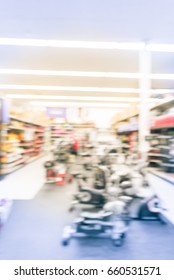 Blur Variety Of Fitness Equipment On Display At Sporting Goods Store In Houston, Texas, US. Defocused Pile Of Dumbbells, Weight, Strength Training, Stepper, Cardio Machines, Gym Service. Vintage Tone.