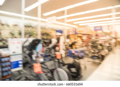 Blur Variety Of Fitness Equipment On Display At Sporting Goods Store In Houston, Texas, US. Defocused Pile Of Dumbbells, Weight, Strength Training, Stepper, Cardio Machines, Gym Room Facility Service