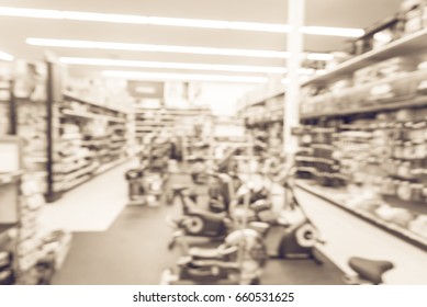 Blur Variety Of Fitness Equipment On Display At Sporting Goods Store In Houston, Texas, US. Defocused Pile Of Dumbbells, Weight, Strength Training, Stepper, Cardio Machines, Gym Service. Vintage Tone.