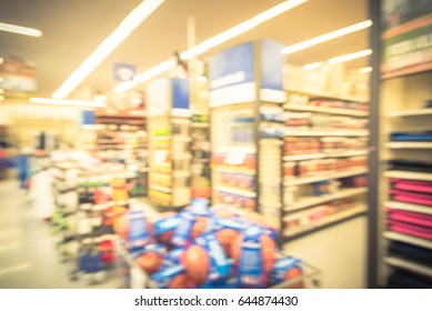 Blur variety of football gears on display at sporting goods store in Houston, Texas, US. Defocused pile of helmet, cleat, pad & protection, gloves, apparel, accessories, bag, coach, training equipment - Powered by Shutterstock