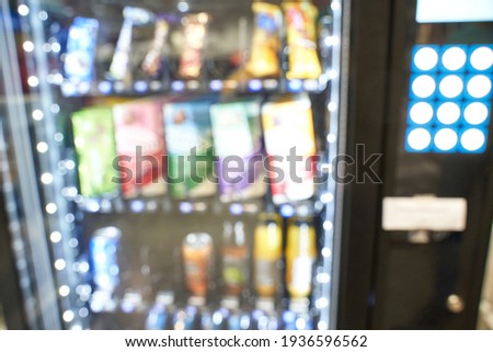 Blur verding machine. Soft focus candy bar. Food store shop. Mars and chocolate dispenser. Junk retail hardware. Delivery merchandise