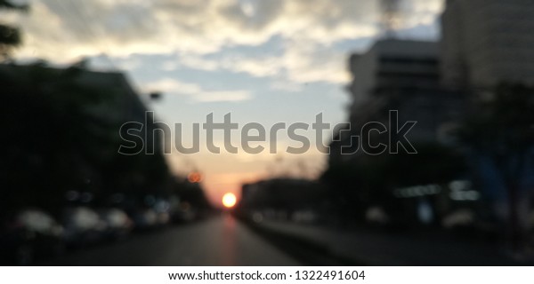 blur view sunset on\
the road in the city