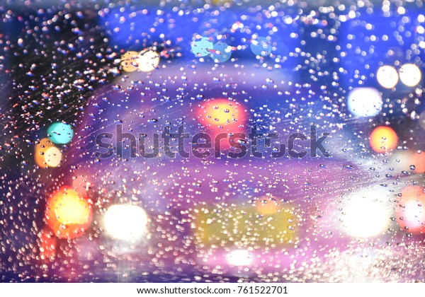 blur vision of\
rain-dropped winshield