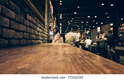 Blur Of Wood Bar Table In Night Cafe /selective Focus Images