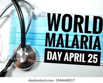 Blur Word WORLD MALARIA DAY APRIL 25 On White Background With Blur Face Mask And Blur Stethoscope.