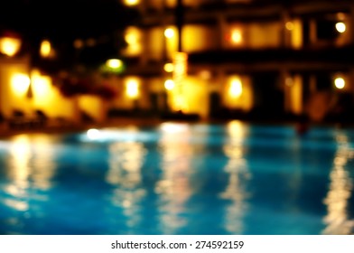 Blur Yellow Golden Light Reflection In Swimming Christmas Luxury Pool Party Water At Night Background  