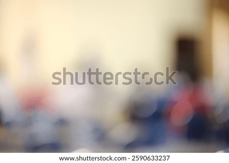 Blured background of a person sitting inside a building