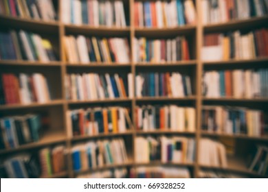 Blured Book Background. Shelves With Multi-colored Books