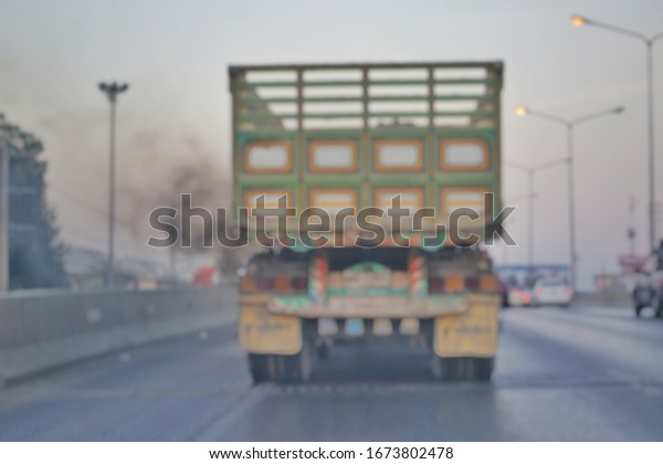  blured a lot of dust from truck on the\
road at prannok road,\
Bangkok,Thailand