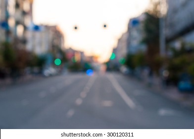 Blured Empty Evening Street At The City. Urban Background.