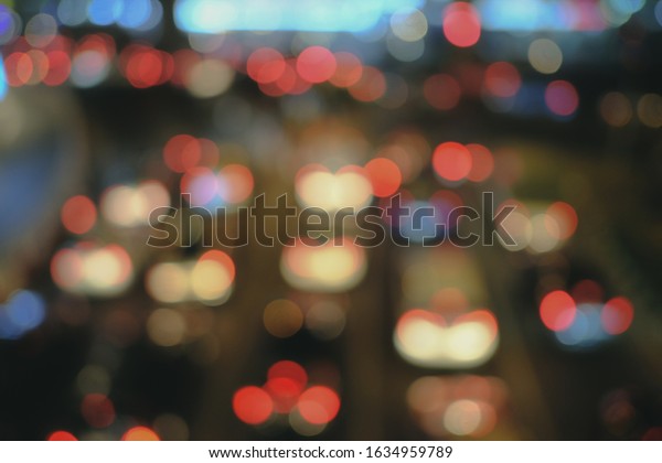 Blured of\
Heavy traffic Jam at the night time in bangkok. with circular\
bokeh. space for text. with selective\
focus