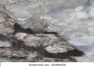 Blured ice texture with reflections of vintage building fontanka river