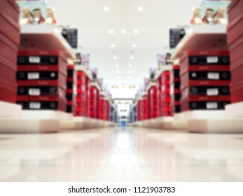 Blured lines or rows shoes boxes on the big store shelves, as background.