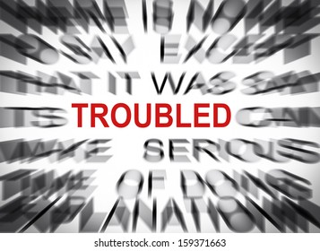Blured text with focus on TROUBLED